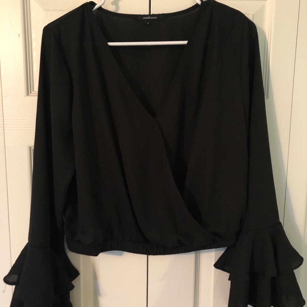Black long sleeve shirt with ruffled sleeves